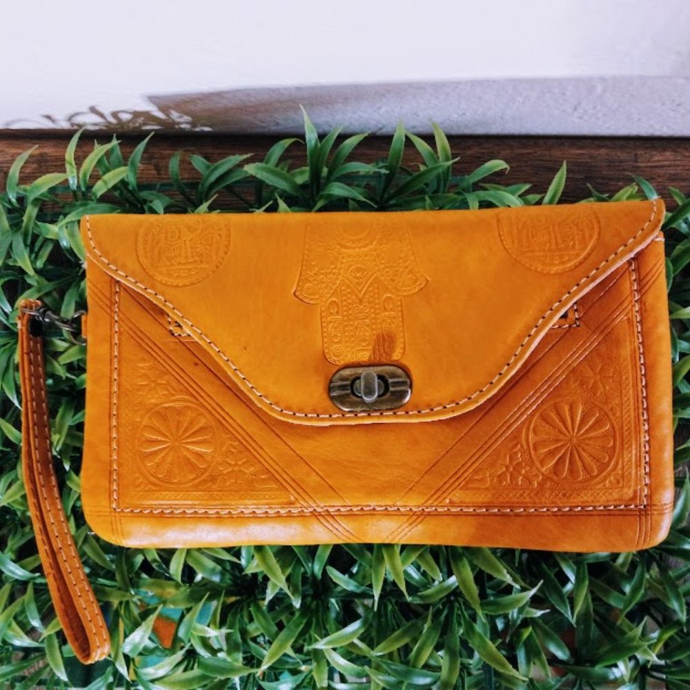 Mustard yellow leather embossed clutch
